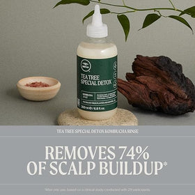 Tea Tree rinse pouring from bottle demonstrating easy application