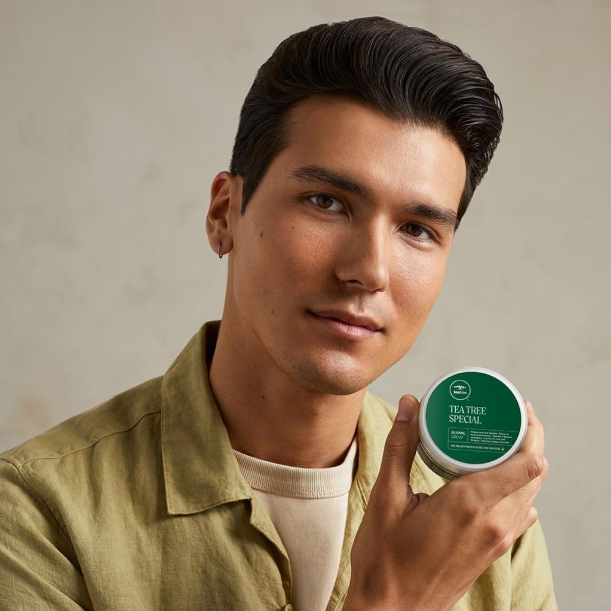 Tea Tree cream being applied to hair adding definition and matte hold