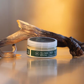 Tea Tree 3 oz jar beside coin for scale, clarifies travel-friendly size