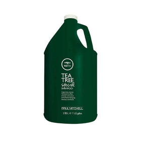 Tea Tree shampoo pouring from bottle highlighting creamy texture and lather benefit