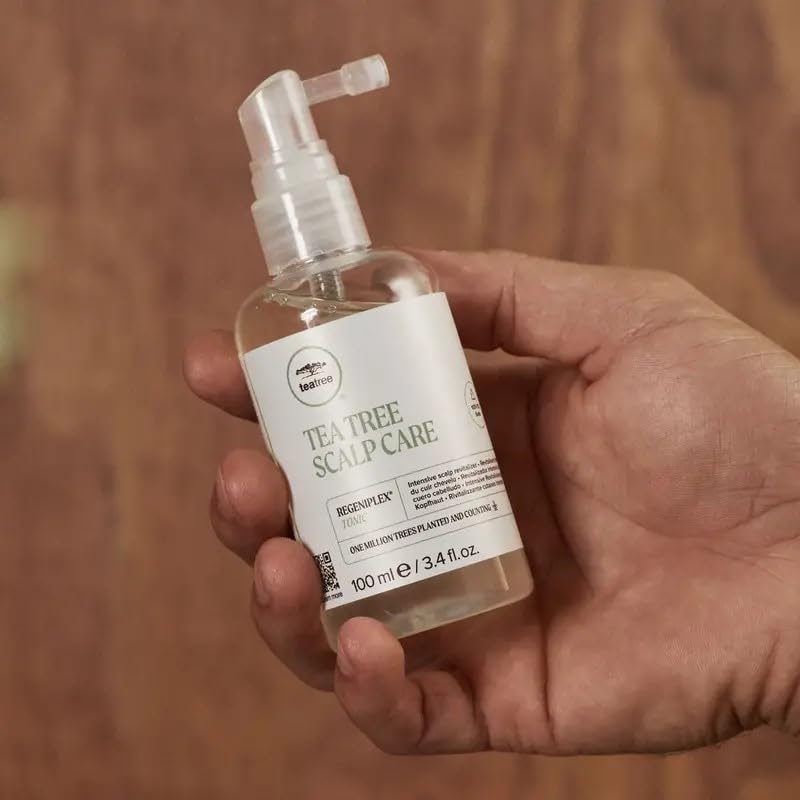 Tea Tree spray nozzle close-up for precise scalp-targeted application