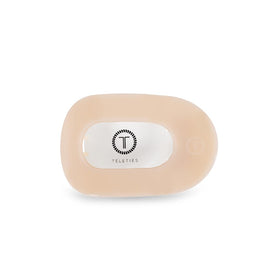 TELETIES flat round clip front view shows sleek almond beige and secure hold