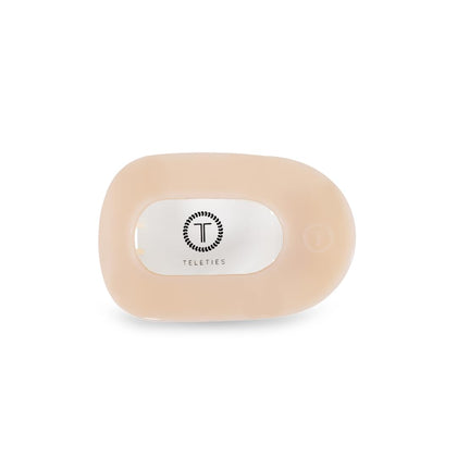 TELETIES flat round clip front view shows sleek almond beige and secure hold