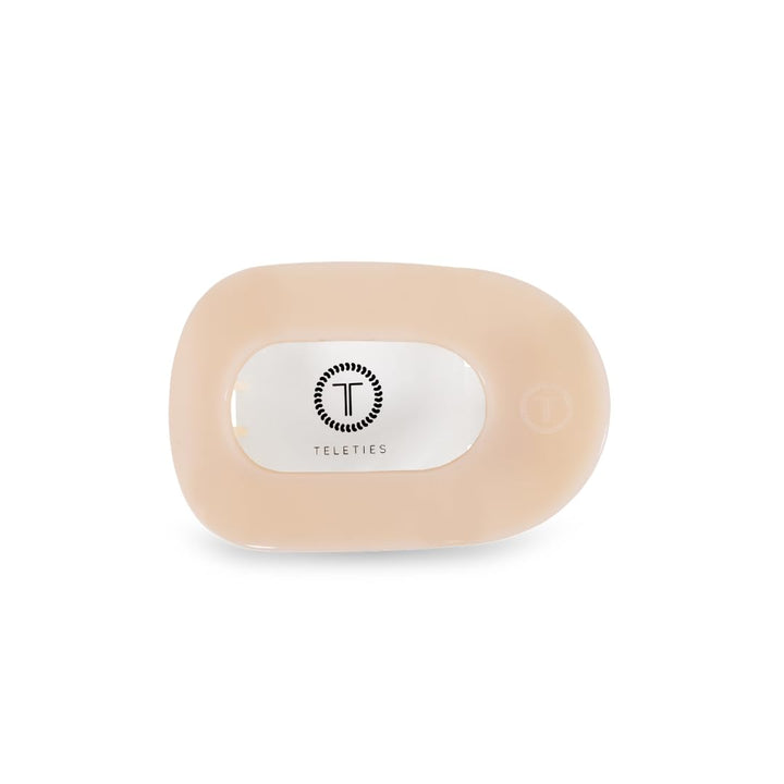 TELETIES flat round clip front view shows sleek almond beige and secure hold