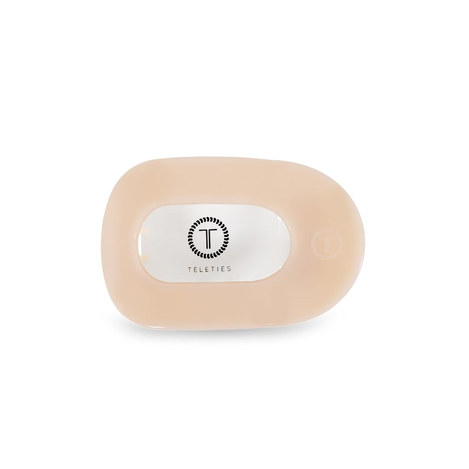 TELETIES flat round clip front view shows sleek almond beige and secure hold