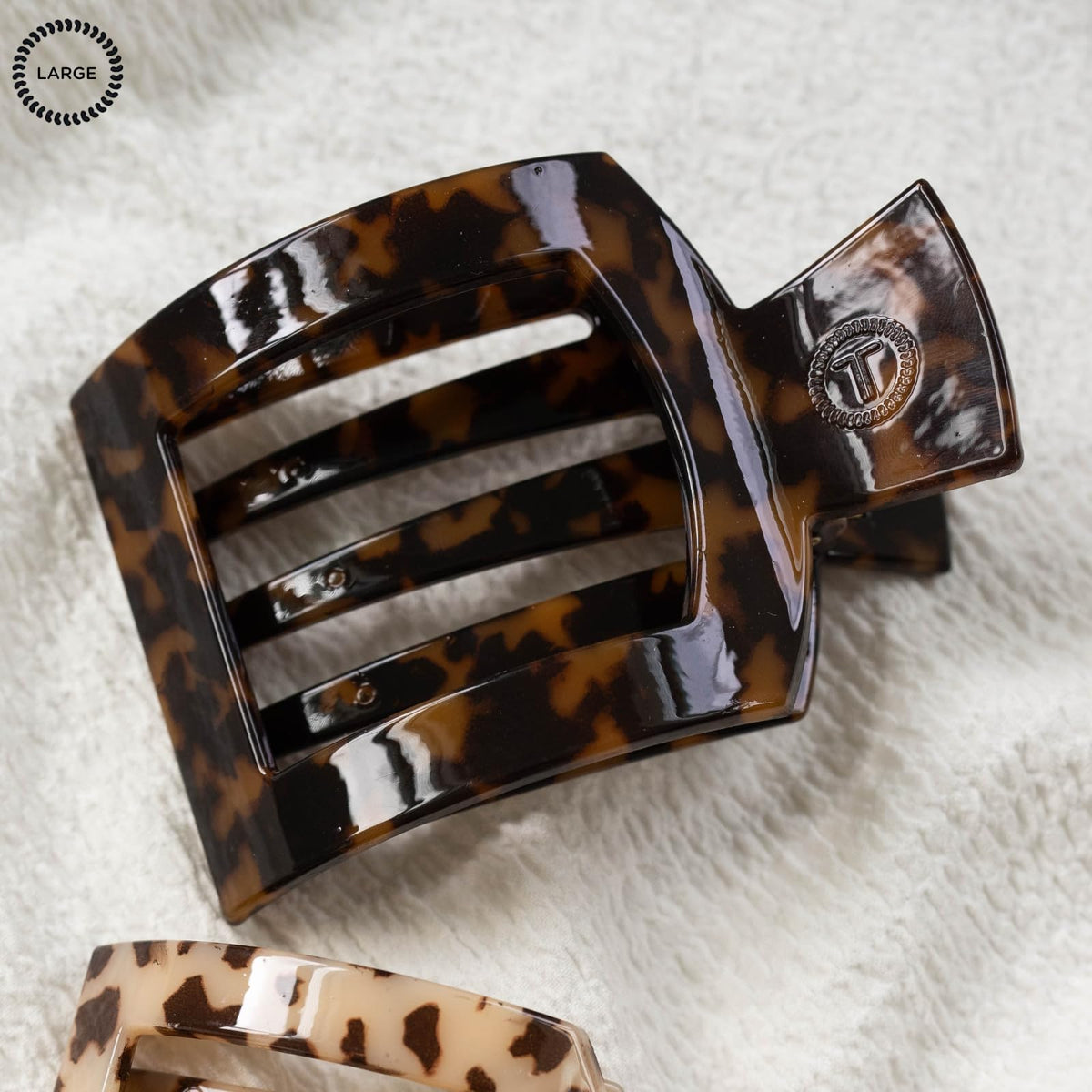 Teleties clip securing an updo while reclining, showing no-slip comfort during use
