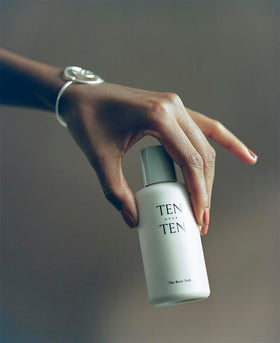 tenoverten bottle beside everyday items showing compact 4 fl oz size