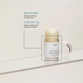 Thank God It's Natural stick held in hand showing compact size and travel-friendly benefit