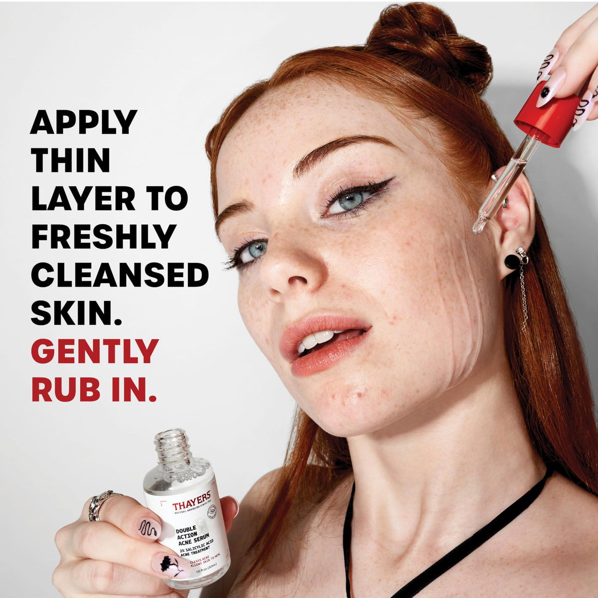 Thayers serum texture on fingertip showing lightweight absorbent formula benefit