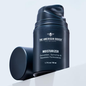 THE AMERICAN BOXER on bathroom counter in morning routine setting