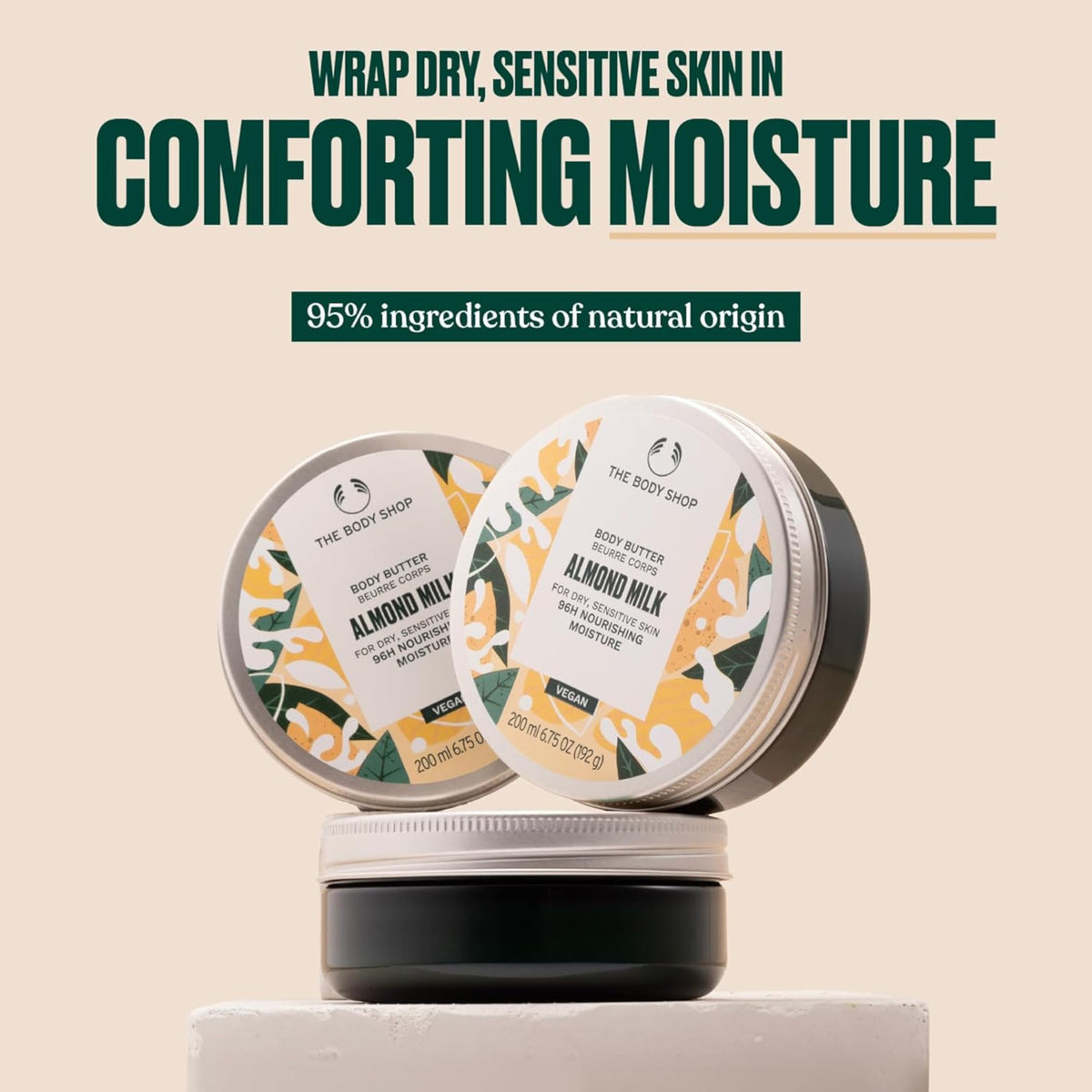 The Body Shop almond milk body butter creamy texture close-up, silky absorption benefit