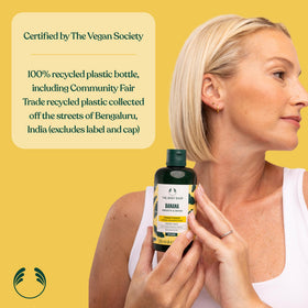 The Body Shop banana conditioner on bathroom shelf in a lifestyle scene, adds cheerful decor