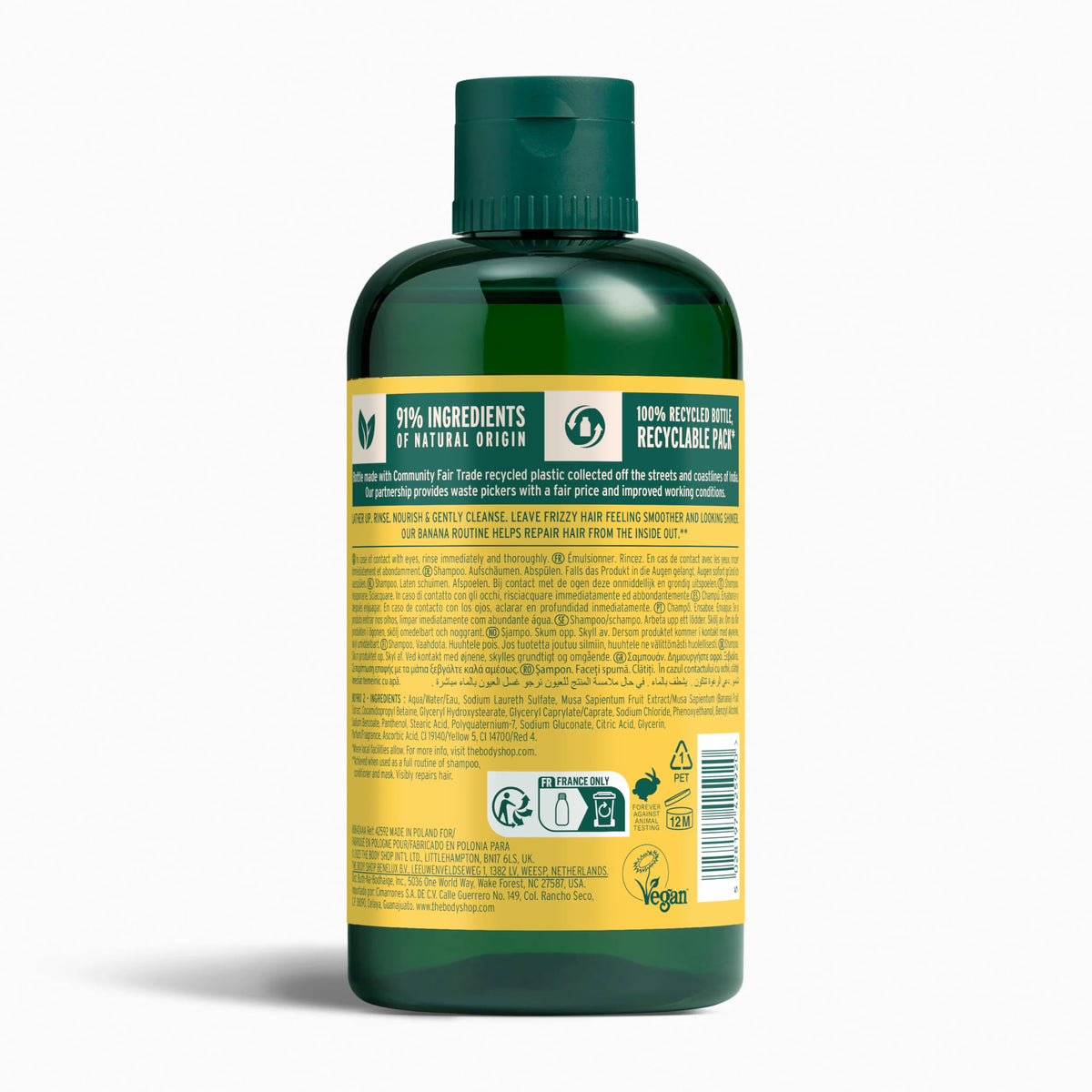 The Body Shop banana shampoo label close-up highlighting ingredients and vegan claim benefit