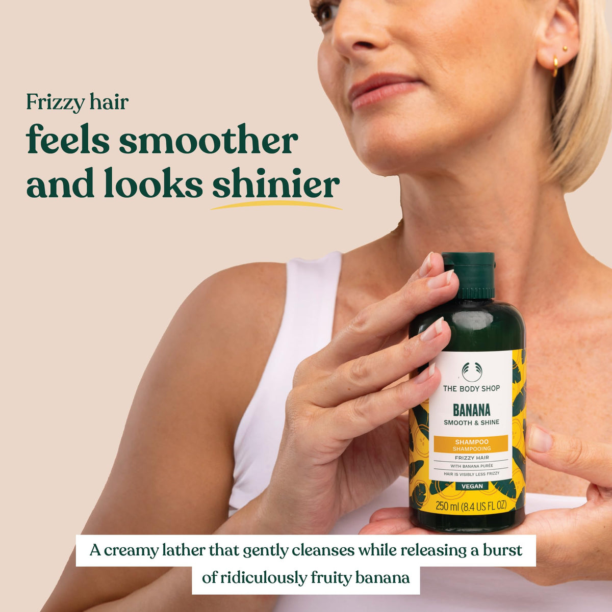 The Body Shop banana shampoo displayed with banana and leaves conveying natural moisture