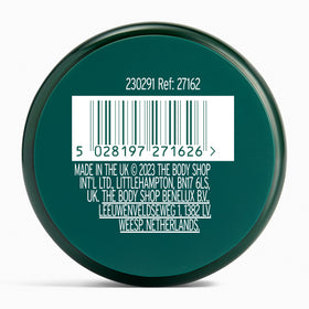 The Body Shop jar staged in a spa setting for relaxing skincare