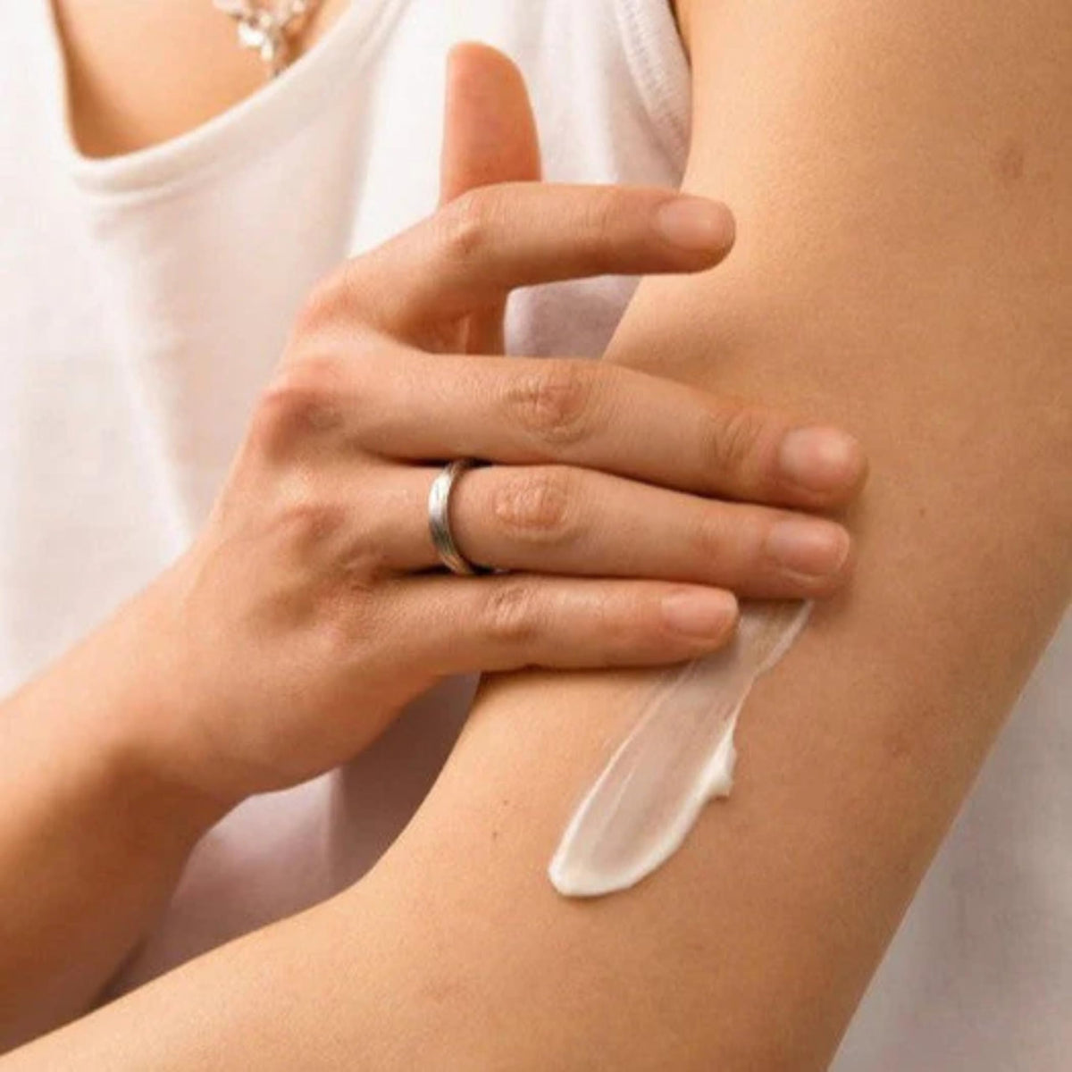 The Body Shop coconut body milk being applied to skin demonstrating quick hydration