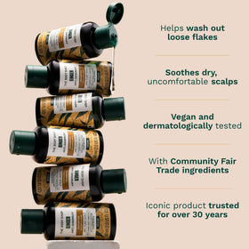 The Body Shop ginger shampoo being massaged into wet hair for soothing scalp benefit