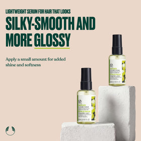 The Body Shop grapeseed serum dropper dispensing a droplet for controlled application and minimal waste