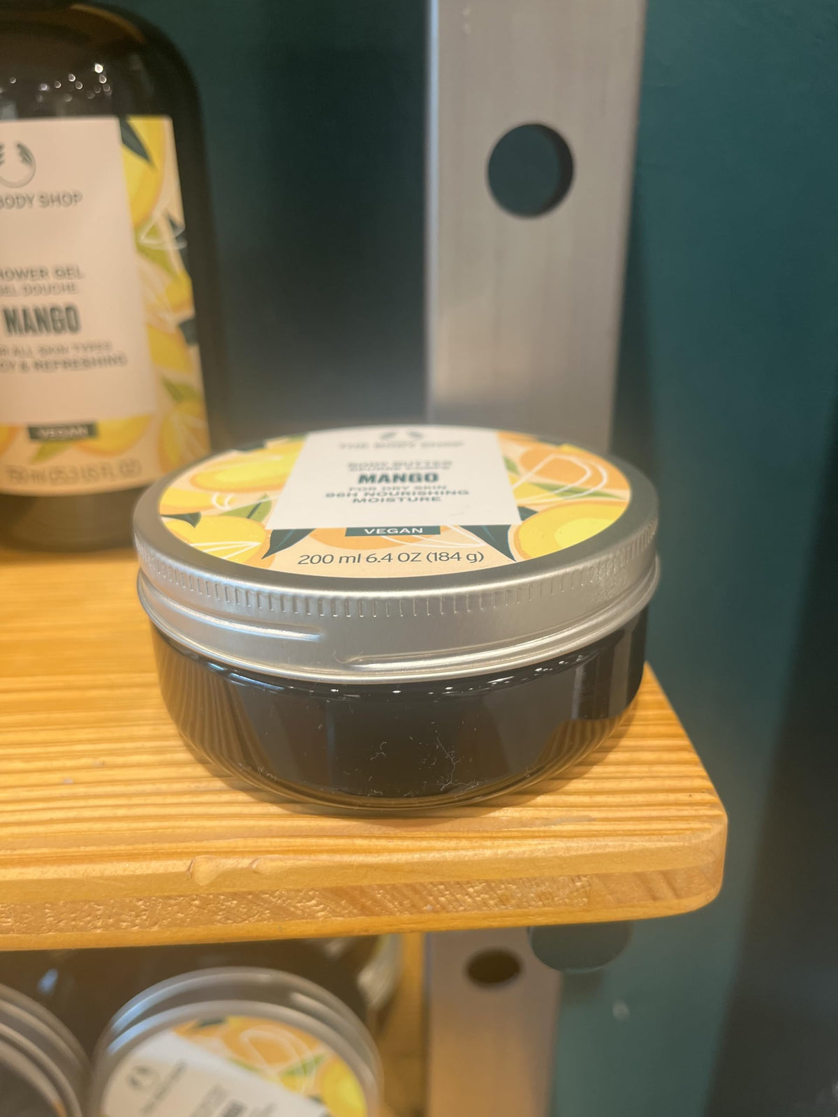 The Body Shop lifestyle scene with summer outfit conveying fresh mango scent and skin confidence