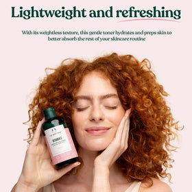 The Body Shop 250 ml bottle held in hand to show size and travel convenience