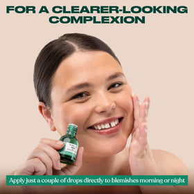 The Body Shop tea tree bottle on a bathroom shelf as part of a daily routine