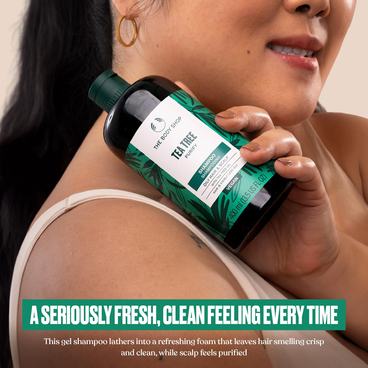 The Body Shop shampoo lather texture close-up, showing gentle foam