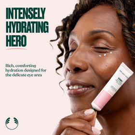 The Body Shop eye cream beside a pen to show 0.5 fl oz size and travel-friendly benefit