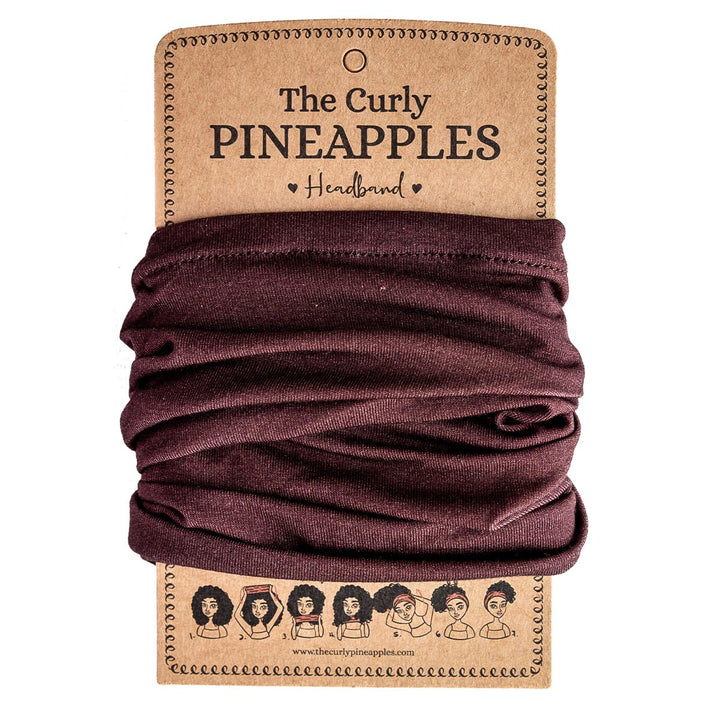 The Curly Pineapples front packaging displaying chocolate brown headband and benefit