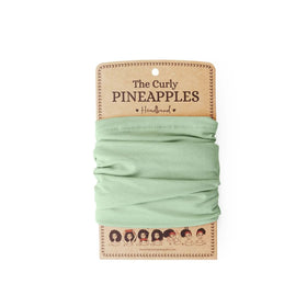The Curly Pineapples front view of mint green headband showing full-width coverage and comfort