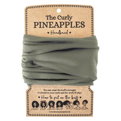 The Curly Pineapples front packaging showing olive headband and benefits