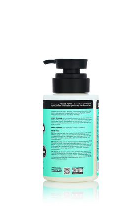 The Doux FAST FORWARD being applied to curly hair demonstrating detangling benefit