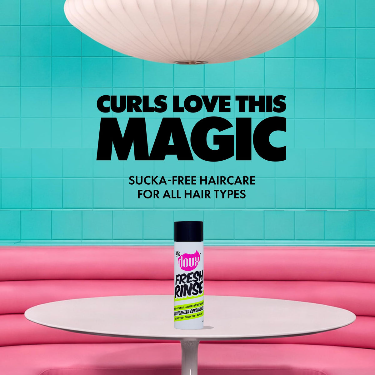 The Doux pouring conditioner into hand showing easy slip for detangling