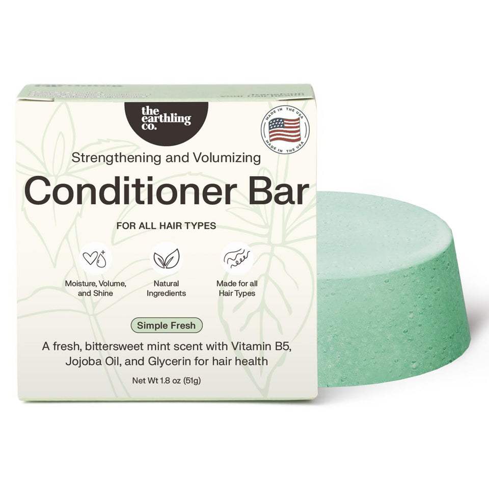 The Earthling Co. front packaging showing compact conditioner bar and benefits