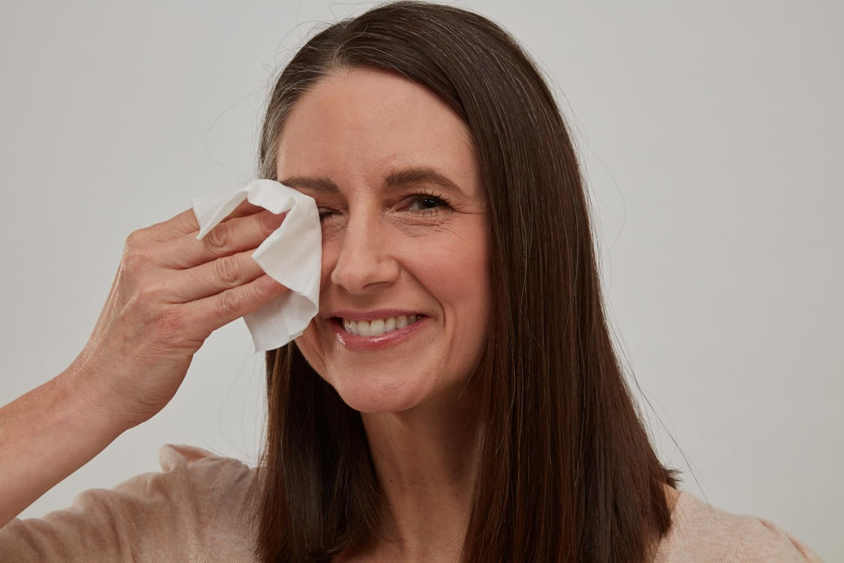 Nightstand with The Eye Doctor wipes and hot compress showing bedside routine comfort