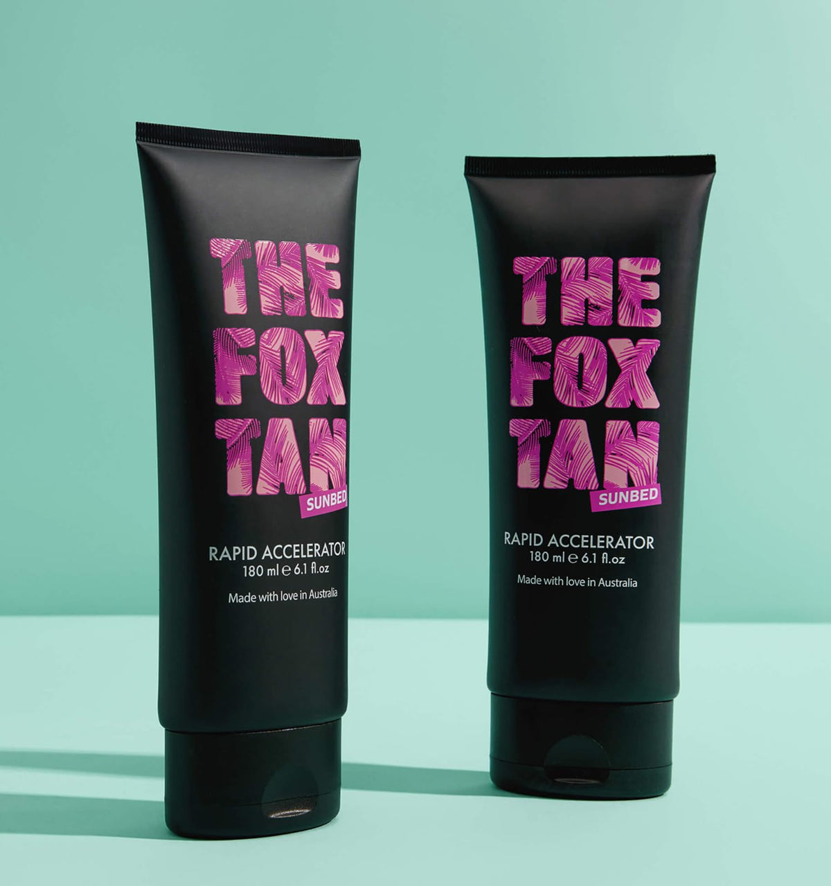 The Fox Tan next to a hand for size comparison showing the 180mL travel-friendly convenience