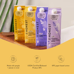 The Honest Company 32 oz carton beside 10 oz bottle illustrating plastic savings