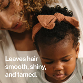 The Honest Company texture droplet on fingertip showing lightweight conditioning benefit