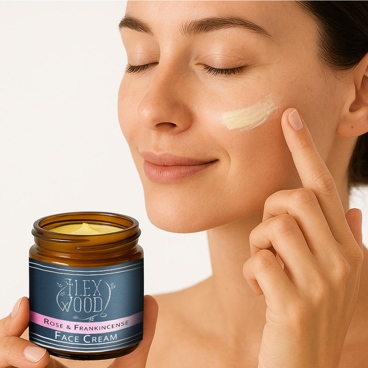 The Ilex Wood woman gently applying cream to face demonstrating soothing, smoothing benefit