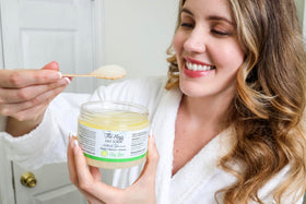 The Keys Salt Scrub scoop on hand demonstrating easy application