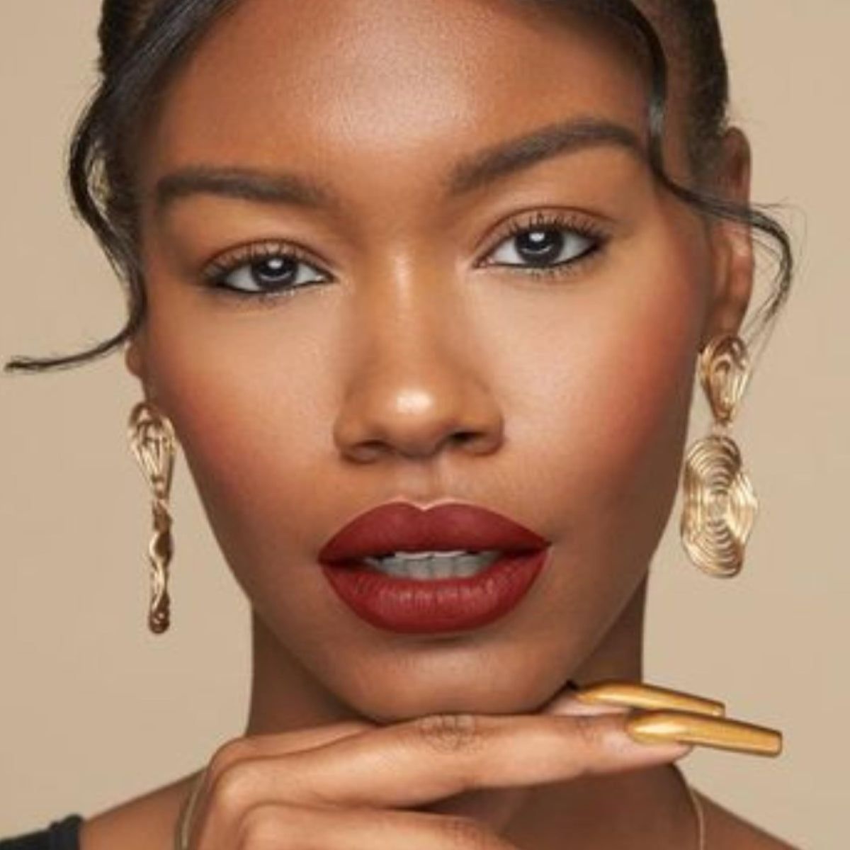 The Lip Bar Brickhouse in a makeup bag suggesting portability and travel-ready benefit