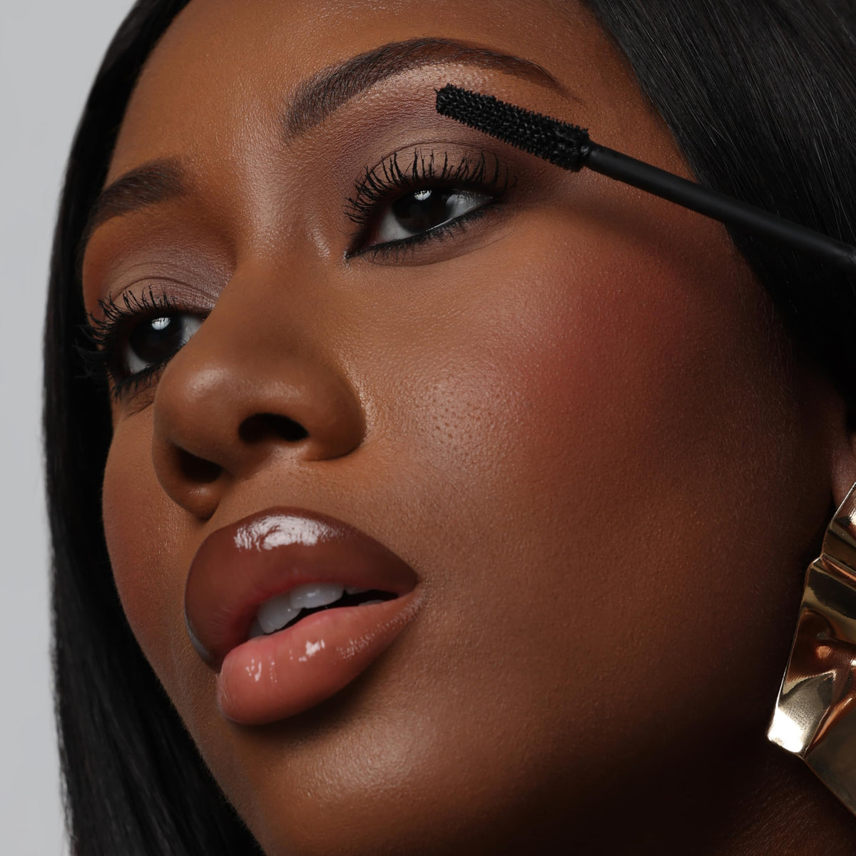 The Lip Bar mascara in a makeup bag lifestyle shot for travel-ready convenience