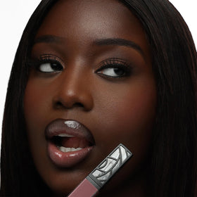 The Lip Bar doe-foot applicator close-up demonstrating smooth, precise application