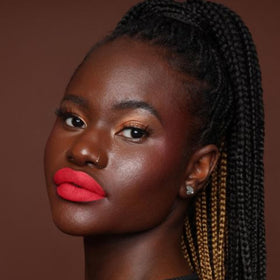 The Lip Bar paired with gloss to show layering options and shine-versus-matte benefit