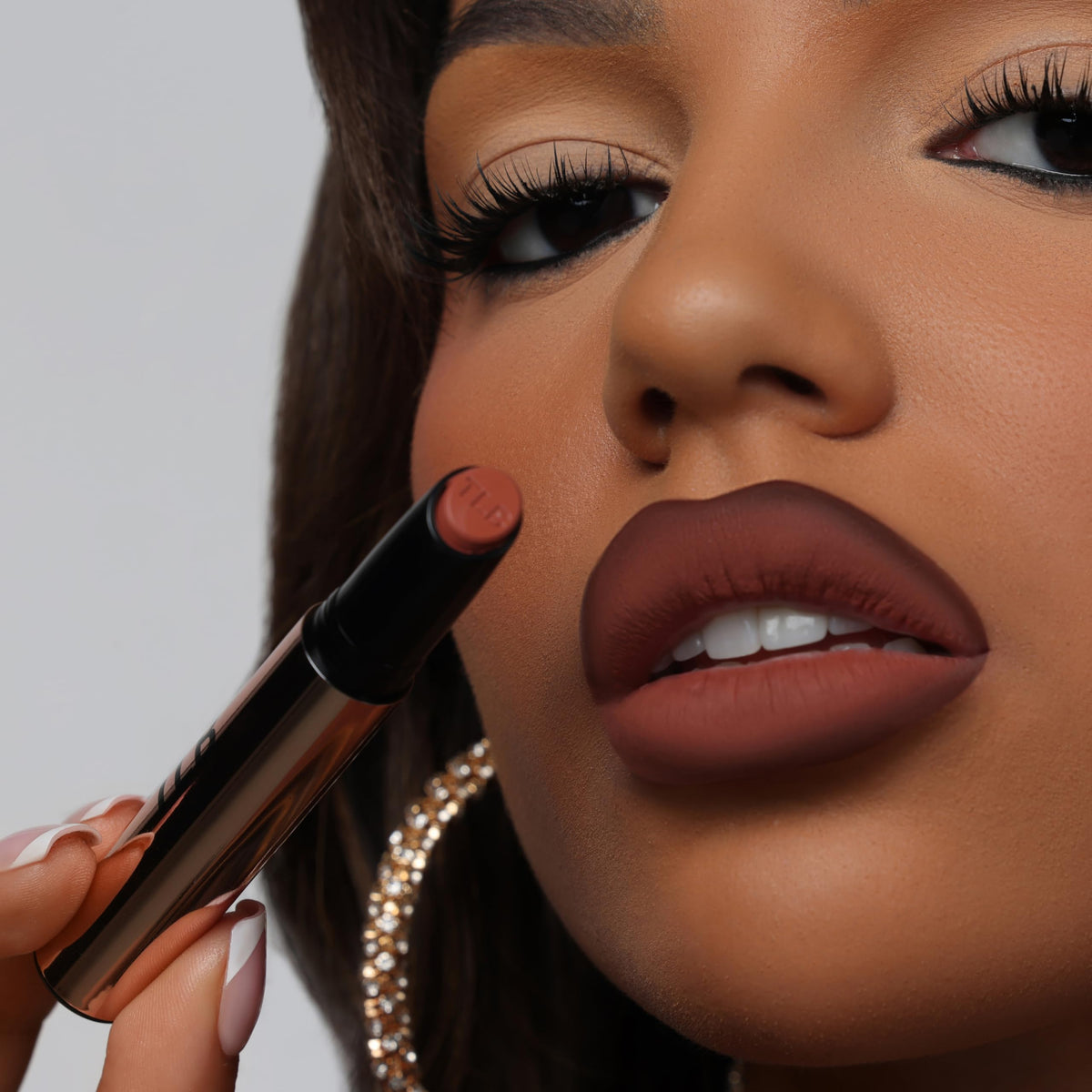 The Lip Bar texture close-up showing creamy matte formula and moisturizing oils