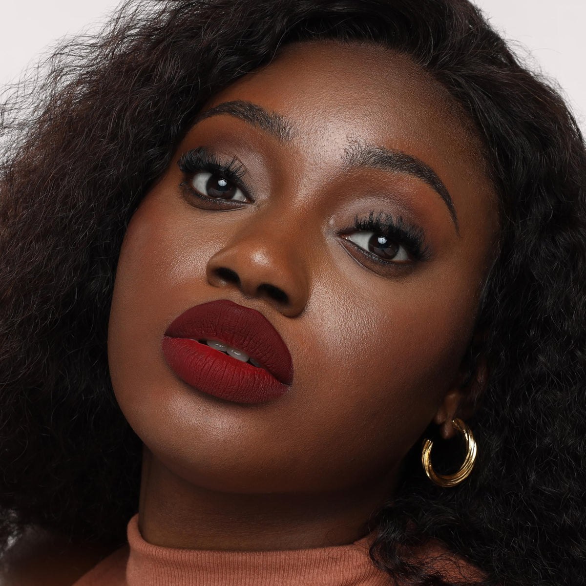The Lip Bar swatches on arm showing true color payoff and buildable coverage