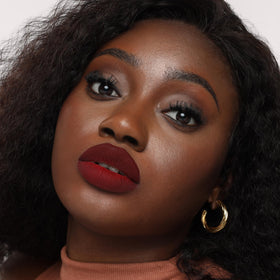 The Lip Bar swatches on arm showing true color payoff and buildable coverage