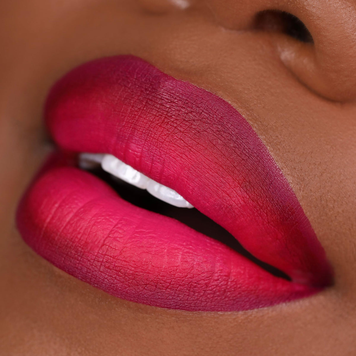 The Lip Bar minis beside a coin to show travel-size convenience and portability