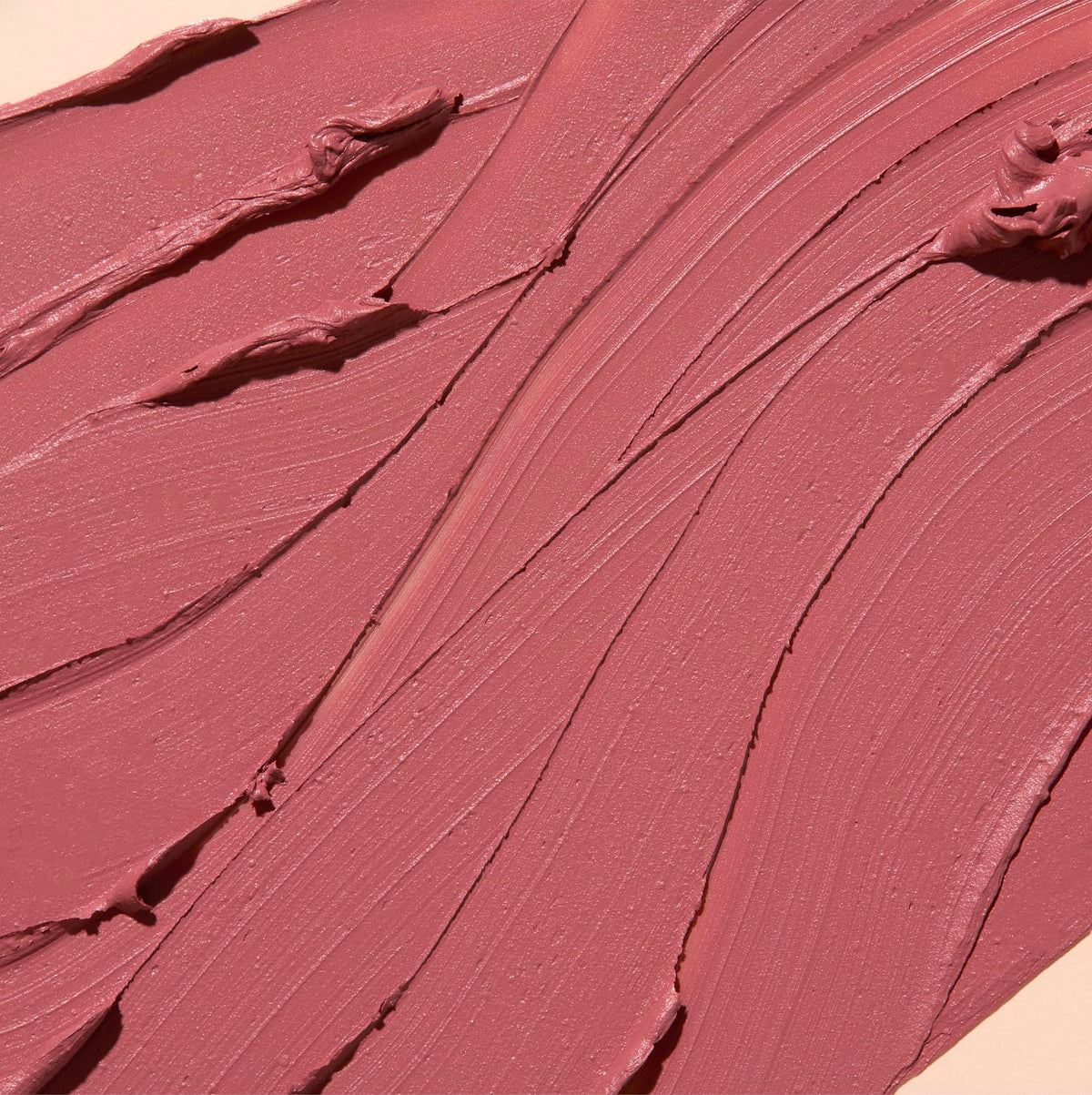 The Lip Bar bullet close-up showing precise tip and creamy glide benefit: accurate application