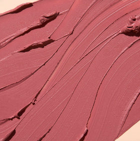 The Lip Bar bullet close-up showing precise tip and creamy glide benefit: accurate application