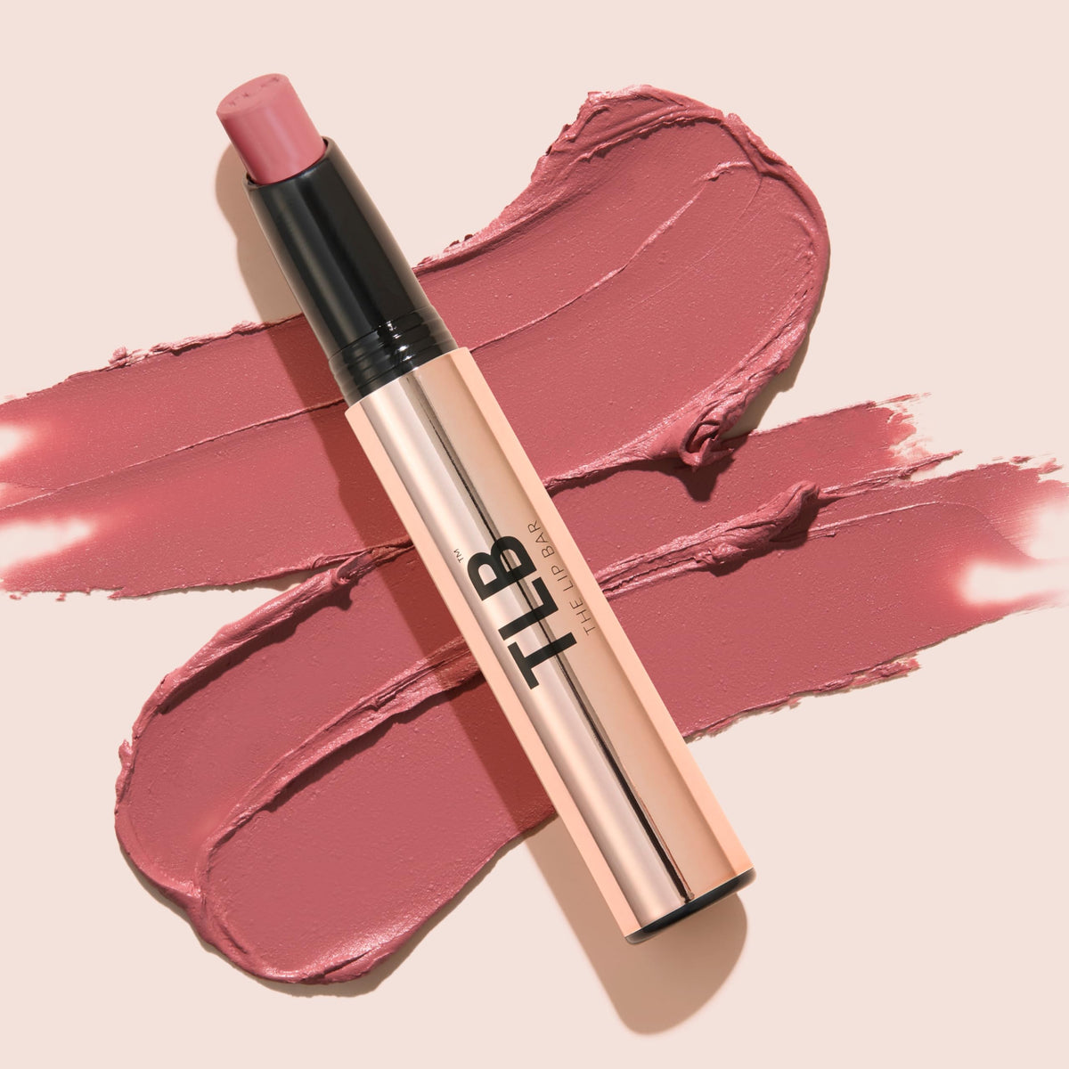 The Lip Bar jojoba and kahai oil droplets highlighting conditioning ingredients benefit: nourished lips